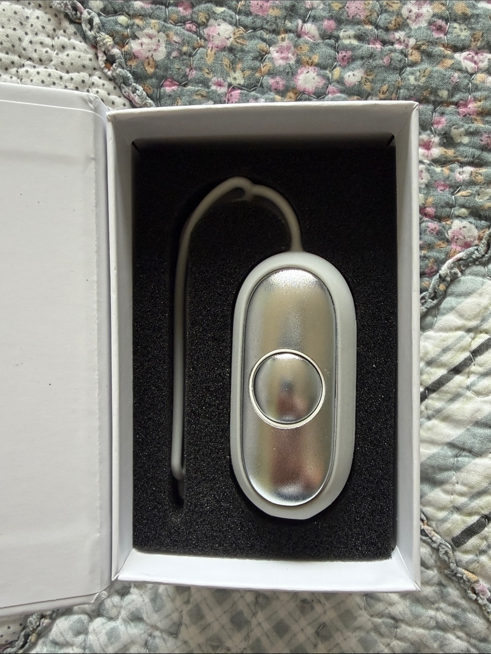 Calm Carry wearable for natural anxiety and stress relief, grey silicone cover